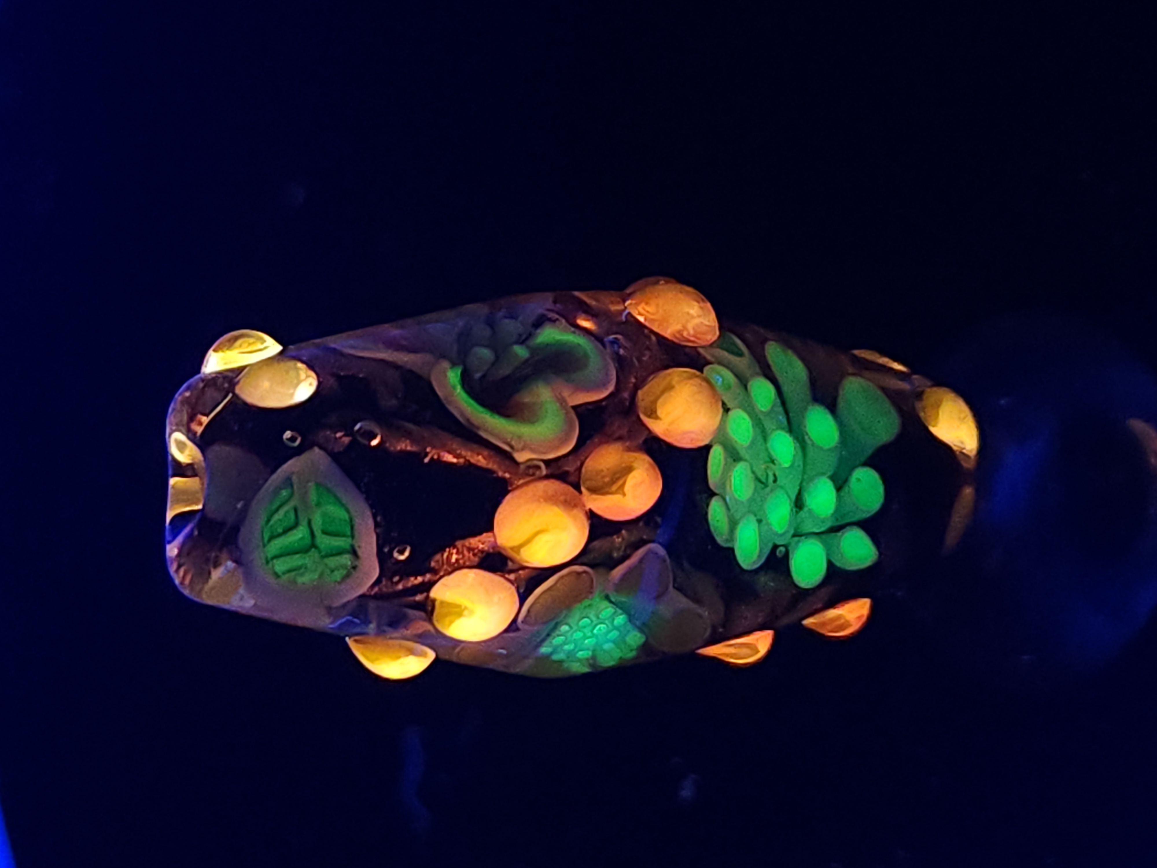 Bi-cone flower murrine bead, with Uranium and Cadmium UV fluorescence