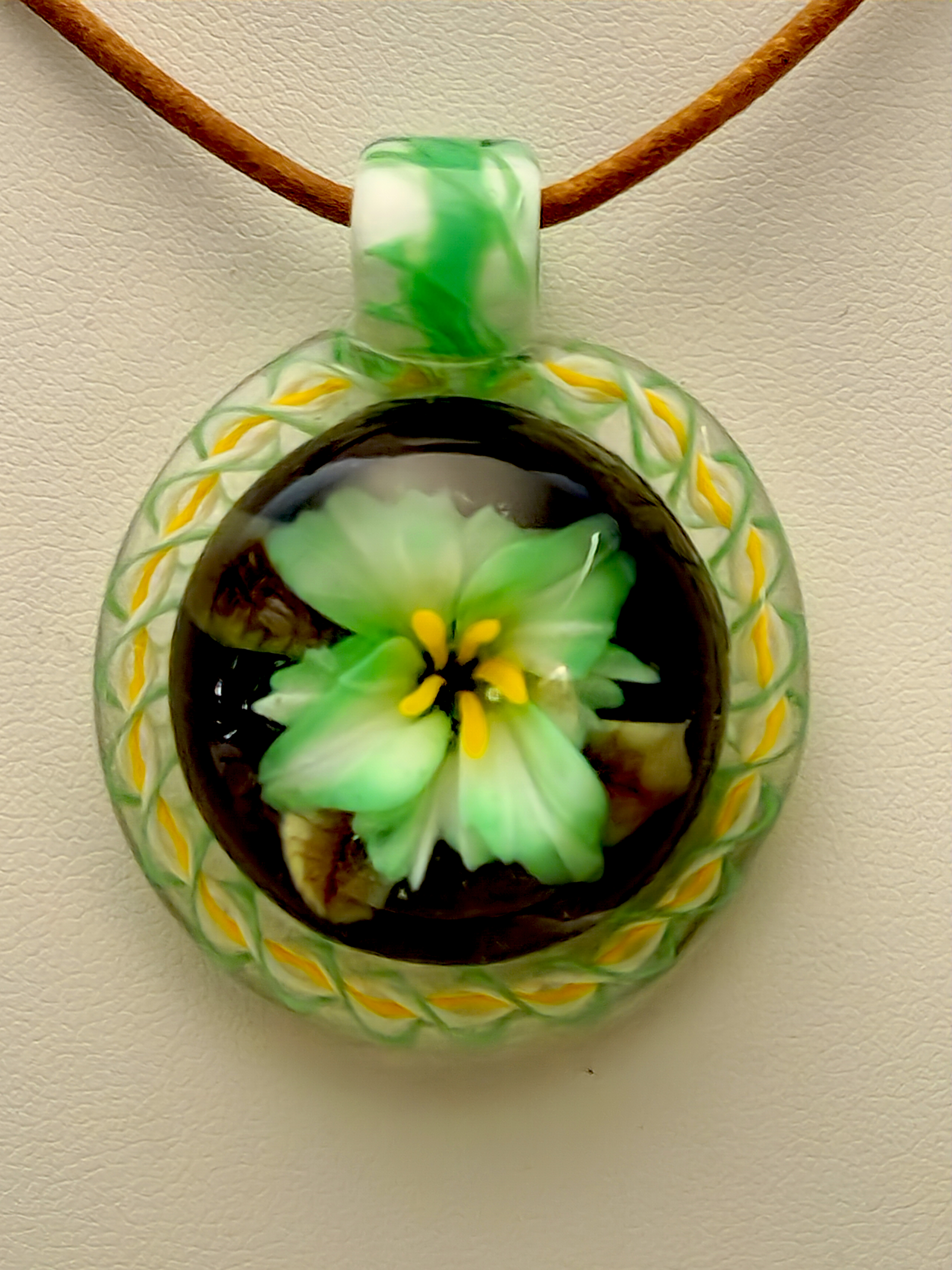 Emerald lily pendant