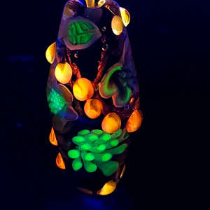 Bi-cone flower murrine bead, with Uranium and Cadmium UV fluorescence