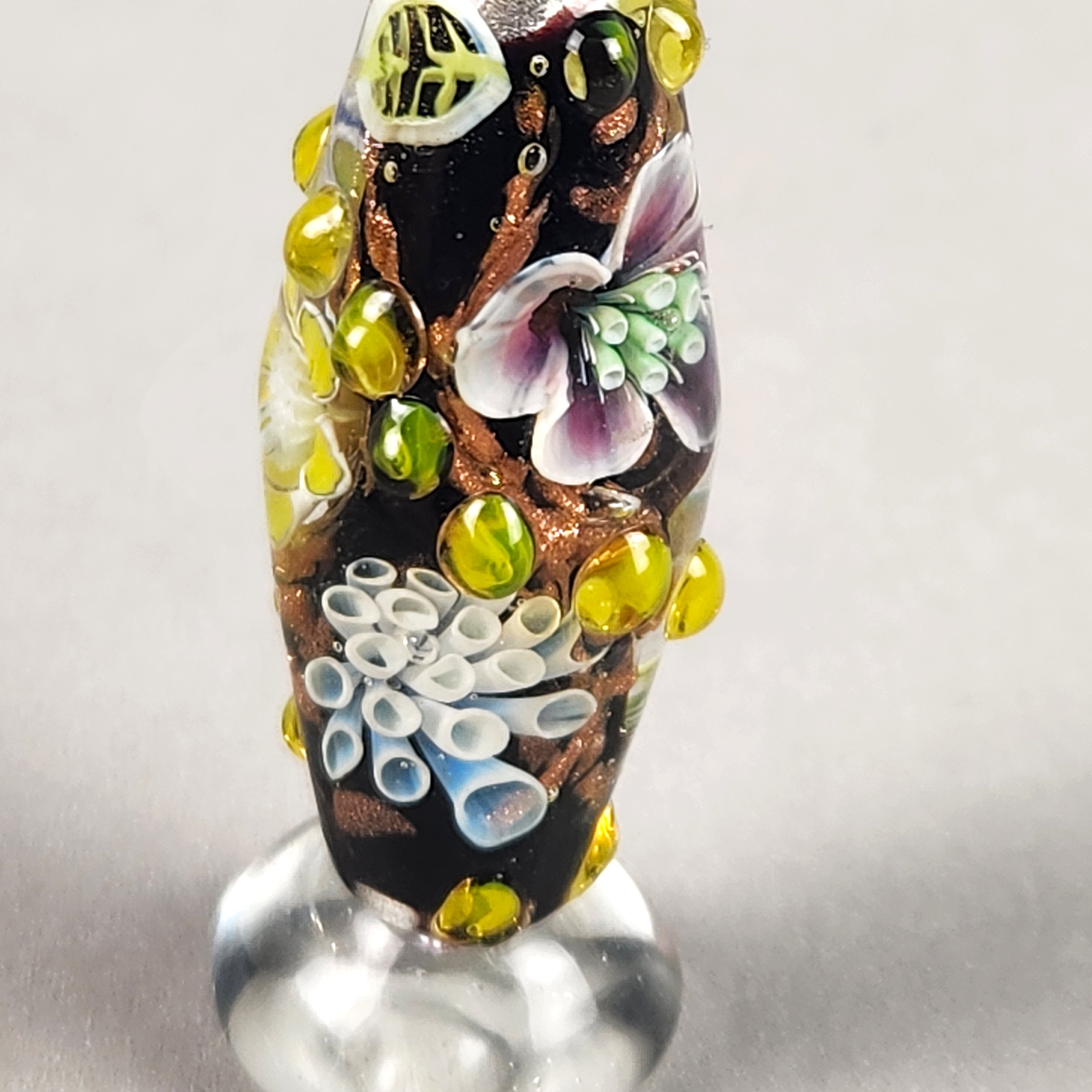 Bi-cone flower murrine bead, with Uranium and Cadmium UV fluorescence