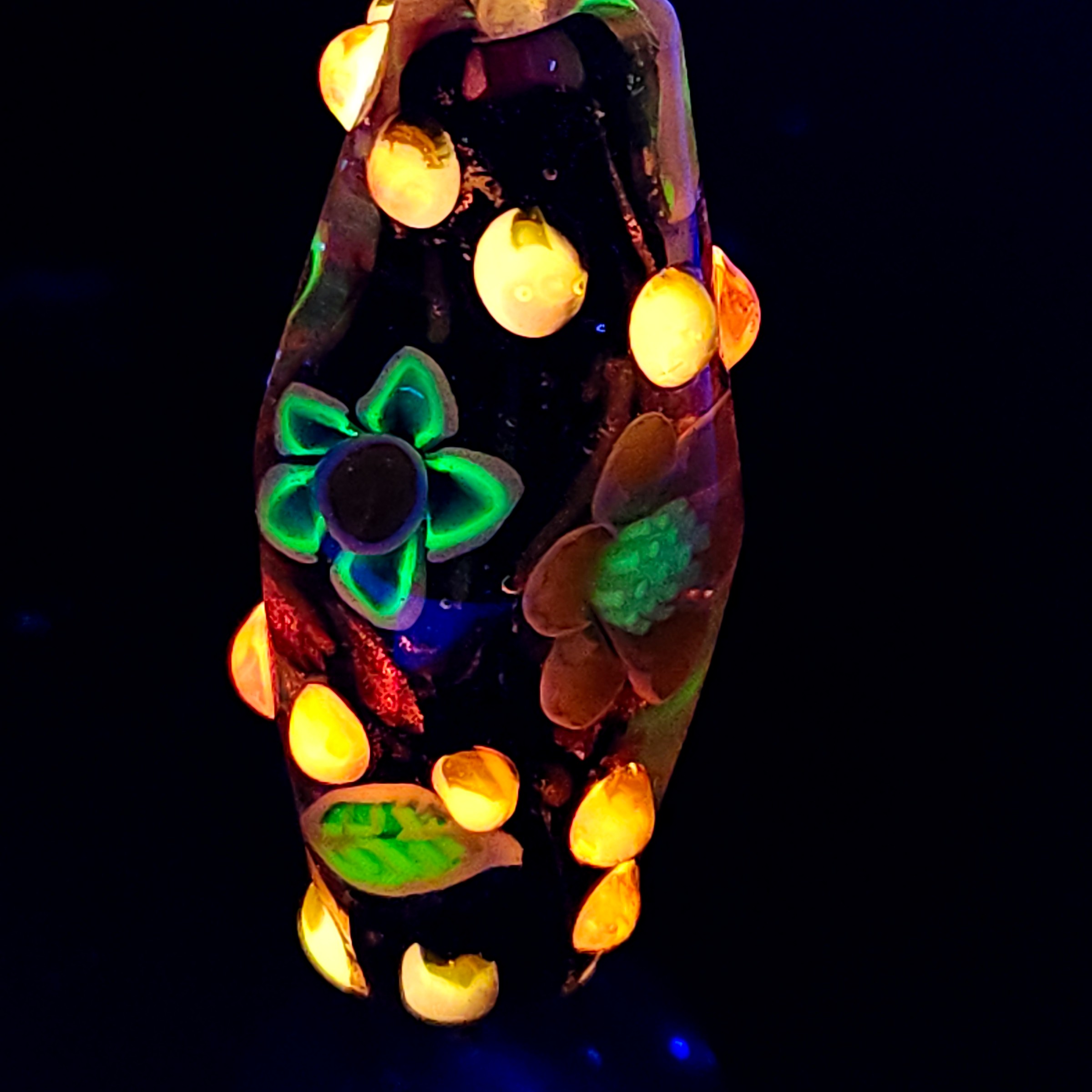 Bi-cone flower murrine bead, with Uranium and Cadmium UV fluorescence