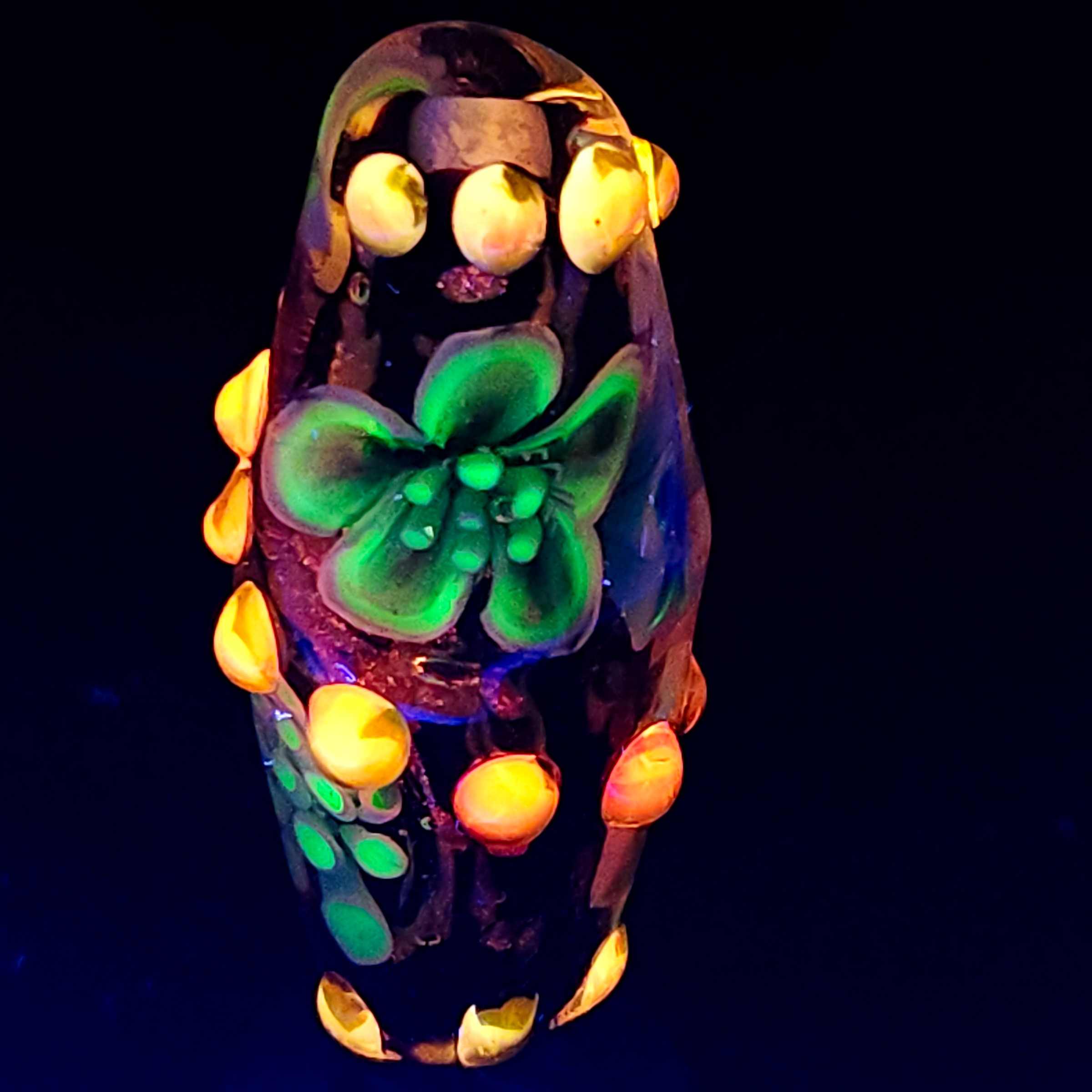 Bi-cone flower murrine bead, with Uranium and Cadmium UV fluorescence