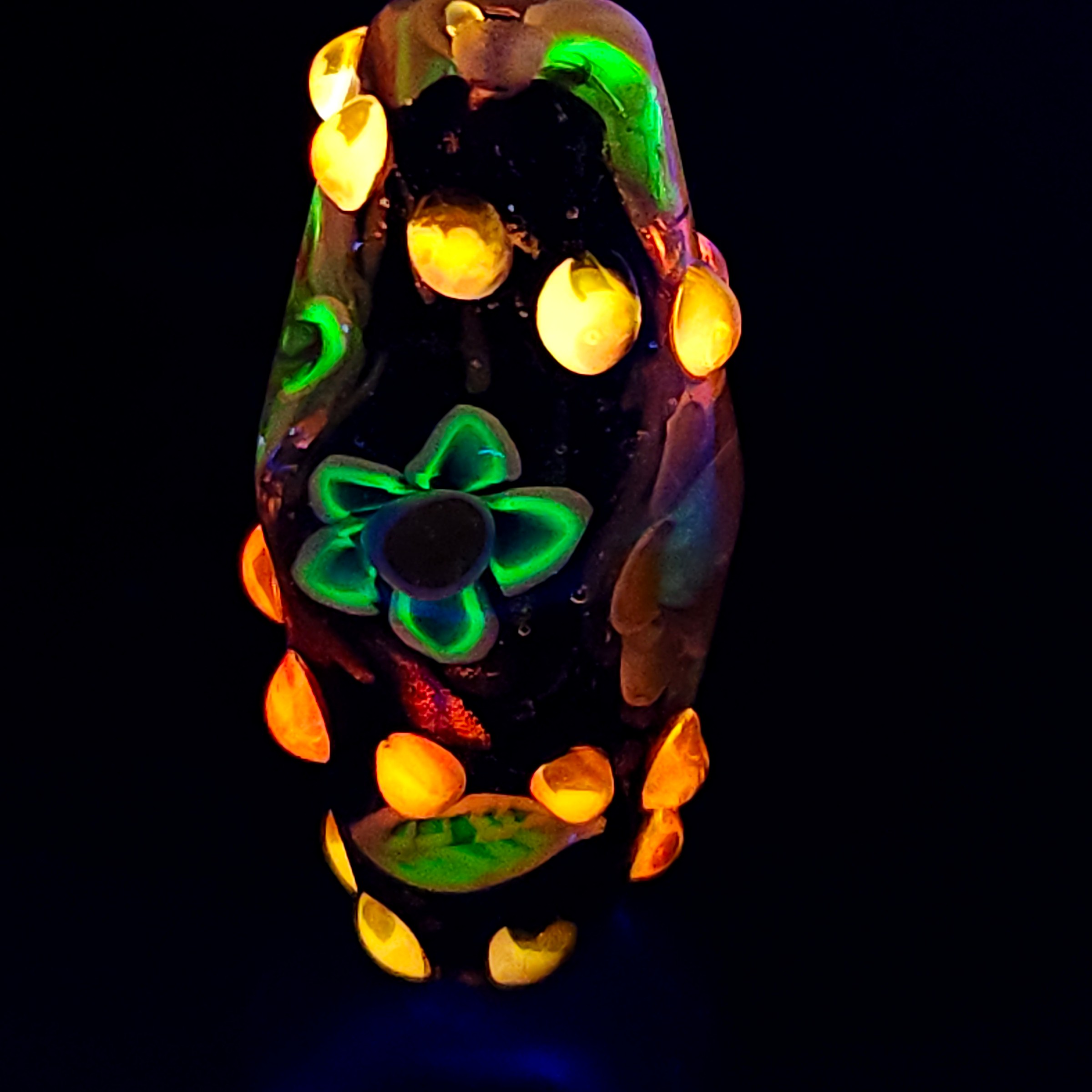 Bi-cone flower murrine bead, with Uranium and Cadmium UV fluorescence