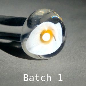 Test bloom of Calla Lily 3-D murrine cane batch 1: a white calla lily with an orange center column in a clear borosilicate sphere