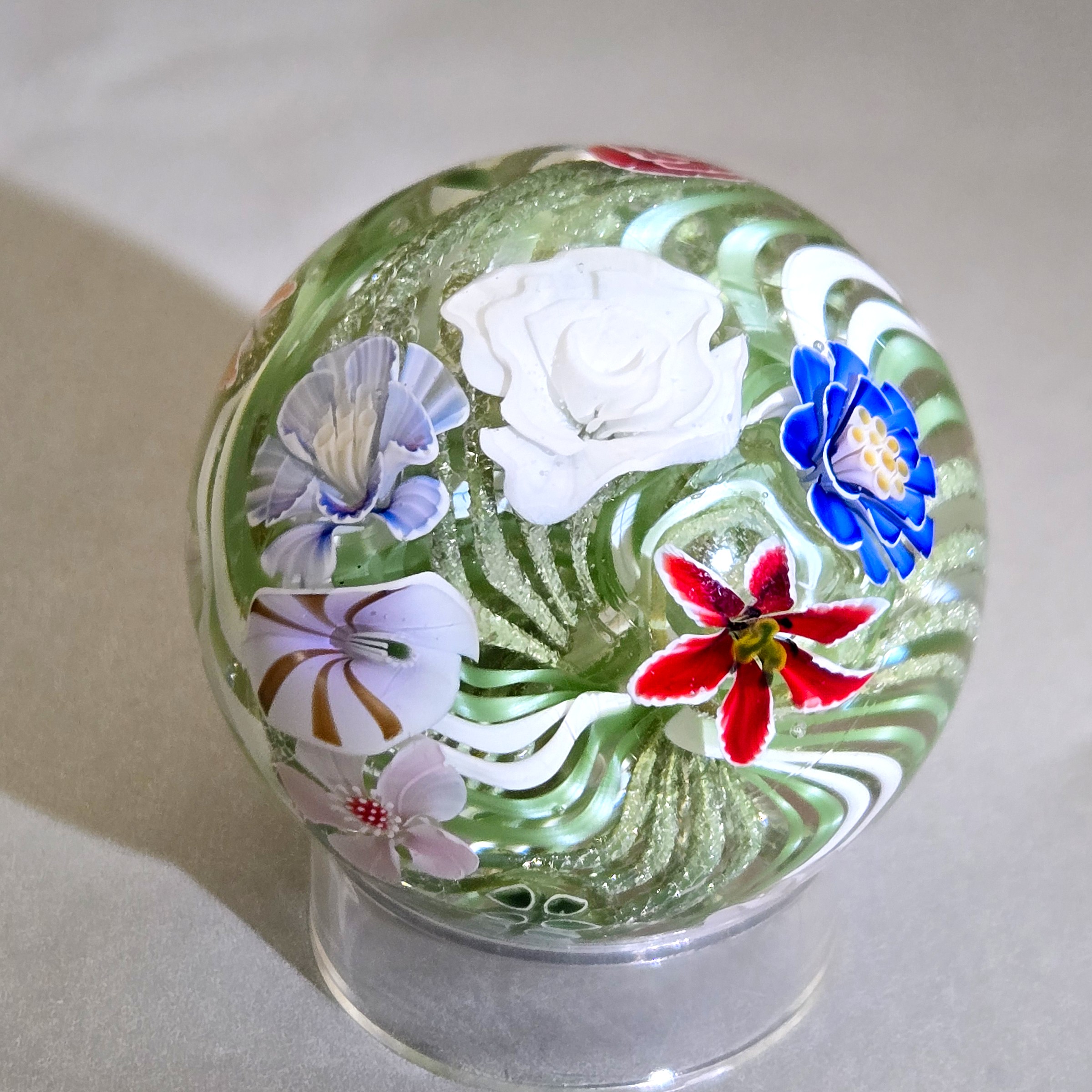 Flower vortex marble, 44mm, with 21 three-dimensional flowers around a green and white core, view 4