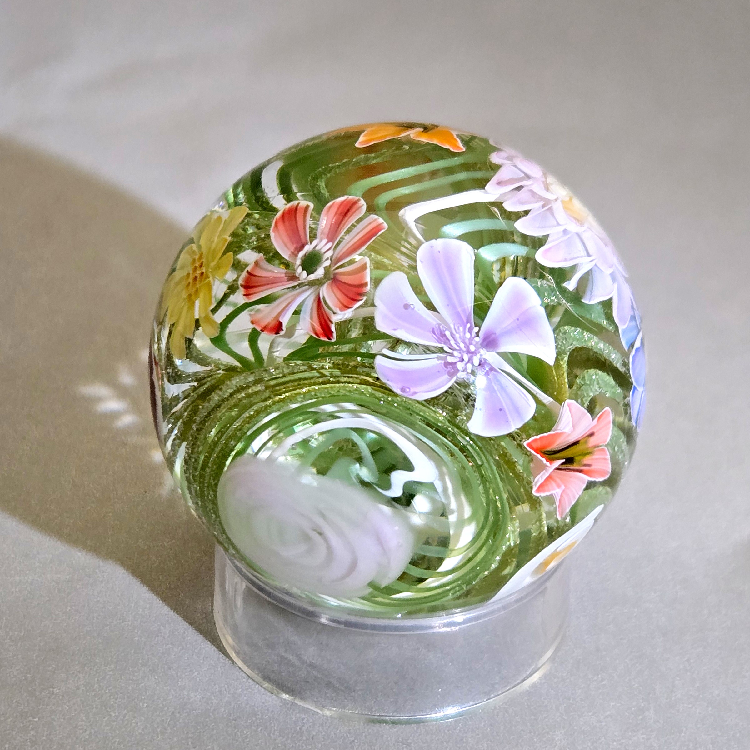 Flower vortex marble, 41mm, with 17 three-dimensional flowers around a green and white core, view 4
