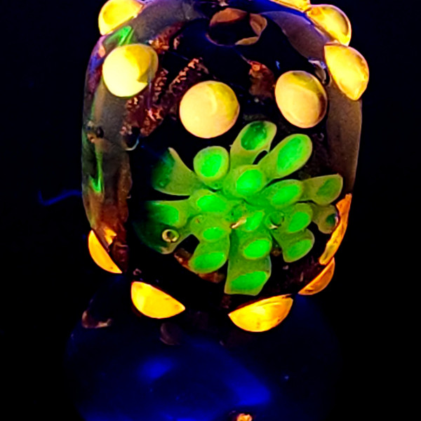 Short barrel flower murrine bead with Uranium and Cadmium UV fluorescence